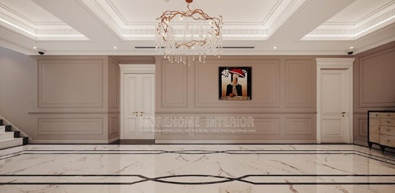 Thiết kế hành lang đẹp ấn tượng với họa tiết độc đáo từ sàn lát đá cùng đường chỉ tường ấn tượng, bức tranh điểm nhấn kết hợp với nét tinh tế từ đèn trần cao cấp. Thiết kế cao cấp